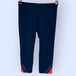 Under Armour size Small leggings, navy with coral accents, EUC